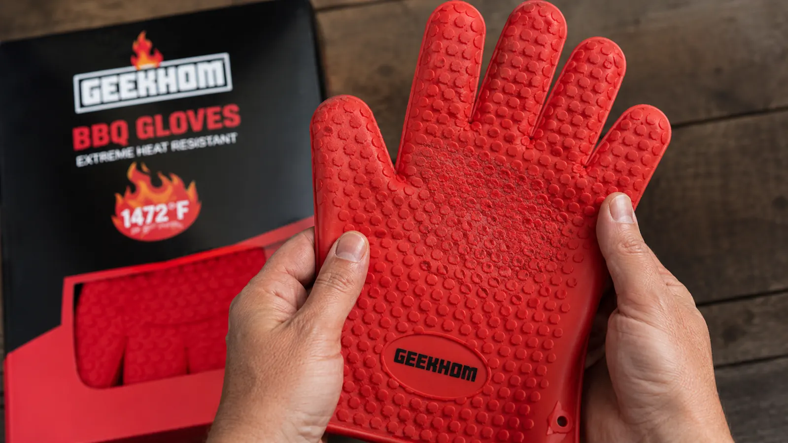 Silicone BBQ gloves showing visible grip texture wear on the palm area after repeated washing and use